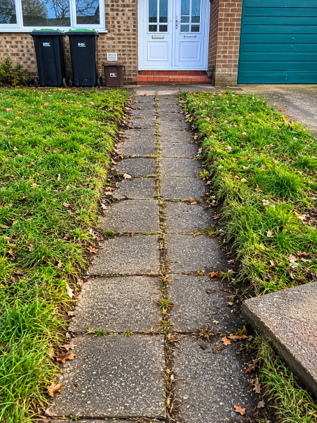 Uneven garden pathway before re-levelling
